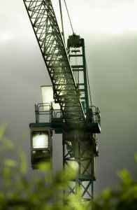 tilt lens photography of black steel crane