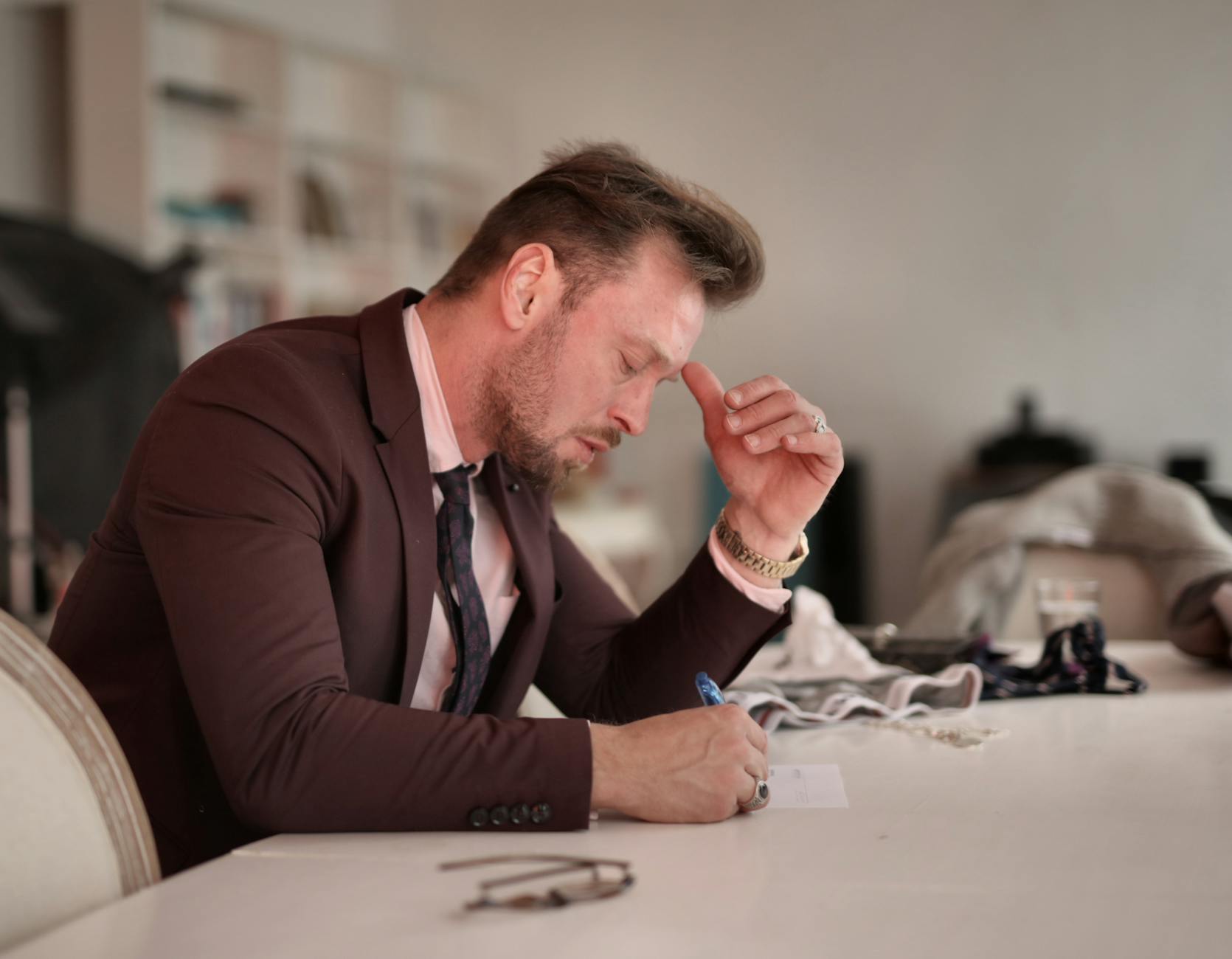focused businessman taking notes at home